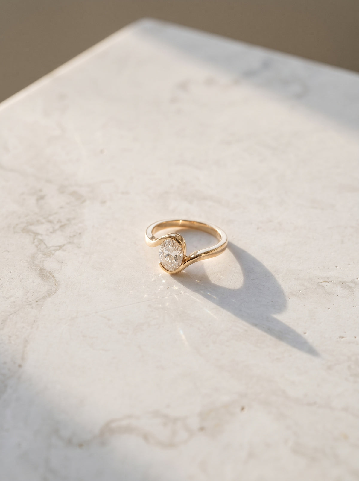 Oval Diamond Bezel Bypass Engagement Ring — styled